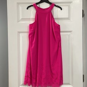 NWT pink halter style dress with cutout detail on bottom.